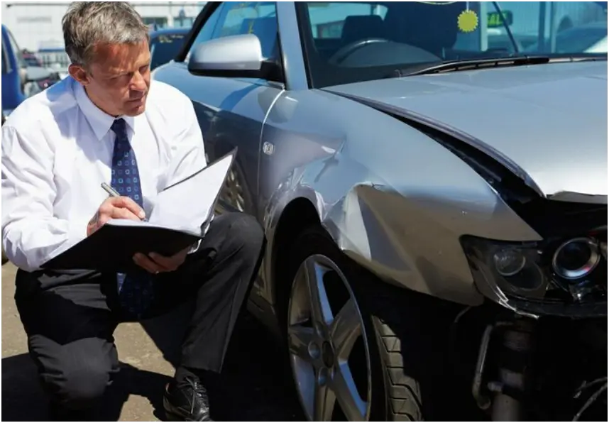 uninsured motorist claim south carolina. South Carolina driver reviewing insurance documents after an accident with an uninsured motorist